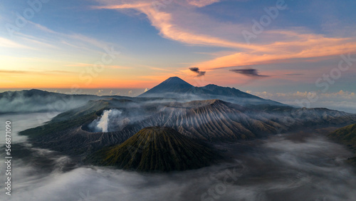 Mt Bromo at sunrise with fog and eruption