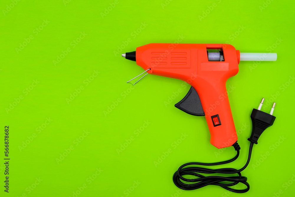glue gun with plastic glue sticks close-up glue gun with plastic glue sticks close-up