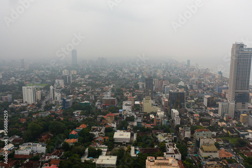 Aerial drone of city of Colombo with skyscrapers in the fog.