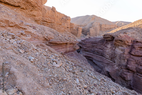 Fantastically beautiful landscape in the national nature reserve - Red Canyon in the rays of the setting sun, near the city of Eilat, in southern Israel
