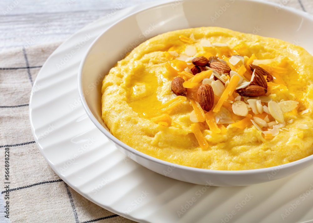 corn grits with butter, vegan cheese, and almonds corn grits with butter, vegan cheese, and almonds