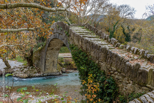 Old stone bridge in Klidonia during fall season. This arch bridge was built in 1853 and it is situated on the river of Voidomatis in Zagori, Epirus Greece.