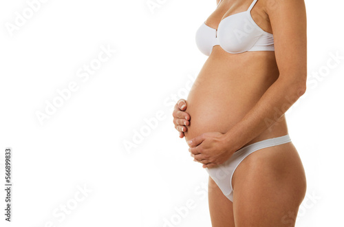 Young pregnant woman,nude photography in the studio