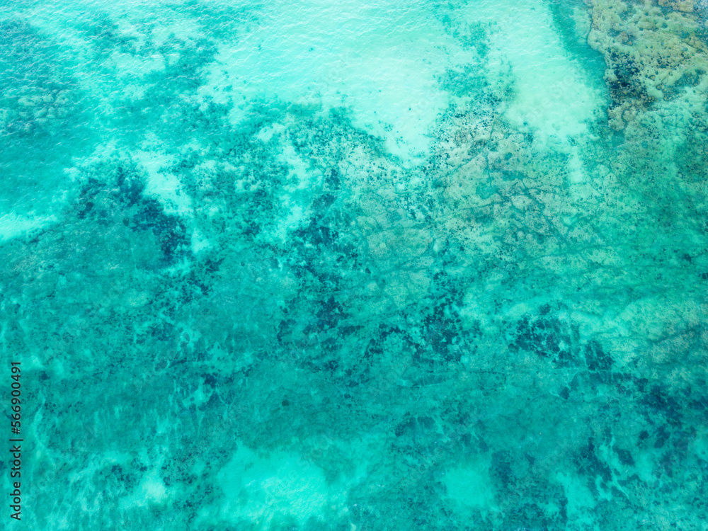 Top view of blue turquoise aqua sea water waves on rocking ocean texture