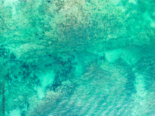 Top view of blue turquoise aqua sea water waves on rocking ocean texture