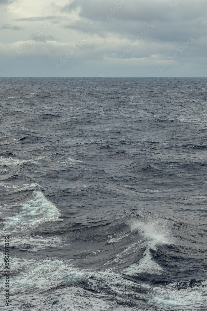 Stormy sea conditions with high swell waves on Atlantic Ocean during transatlantic passage crossing on ocean liner