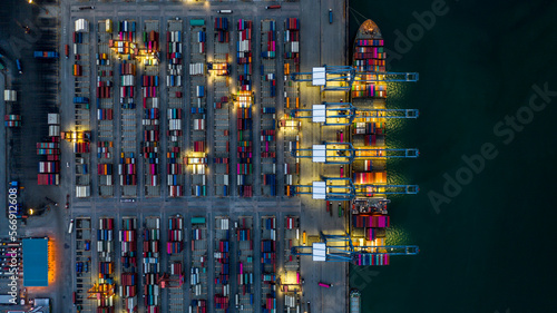 Aerial view container cargo ship industrial port working at night, Container cargo ship global business freight shipping logistic import export transportation international, Container cargo ship. © Darunrat