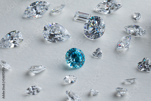 Obraz na płótnie Coloured diamonds of different sizes at the workplace of a diamond expert sorting