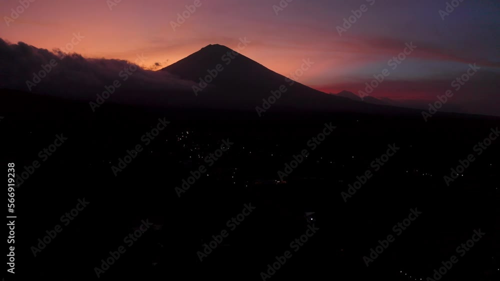 Beautiful sunset behind the high Mount Agung in Bali. Backwards drone dolley shot Beautiful sunset behind the high Mount Agung in Bali. Backwards drone dolley shot