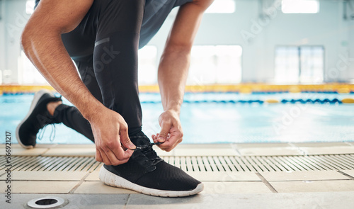 Fitness, shoes and man getting ready for training, exercise or running with sports sneakers, fashion and energy. Feet of an athlete, runner or person tying his laces for cardio or workout motivation