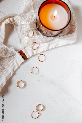 Flatlay with candle and jewelry, add your own text or a mood onto it, empty copy space 