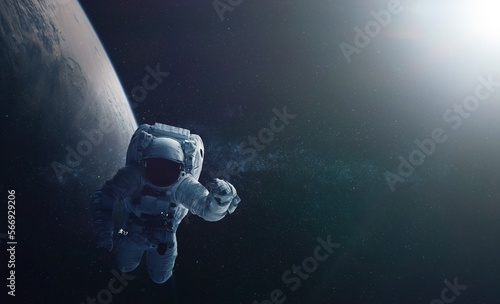 Astronaut and space background. Elements of this image furnished by NASA. photo