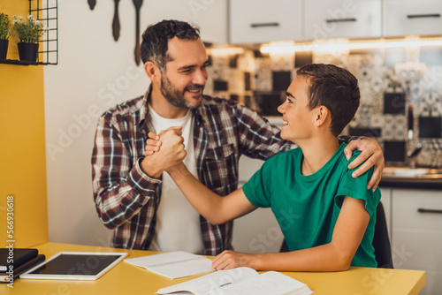 Φωτογραφία Father is helping his son with learning