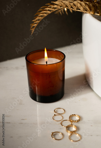 Brown Candle with the jewelry in a bathroom, add your own logo or a text, mockup file 
