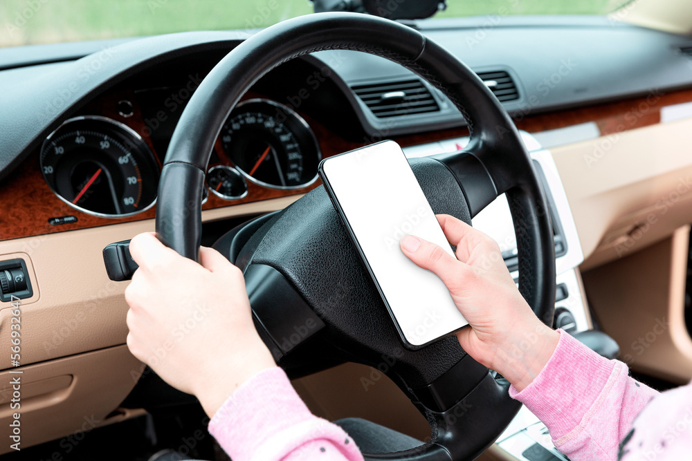 mobile phone in hands with a cut-out screen in the car. smartphone mockup