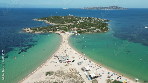 Sardinia Peninsula Island Isolo dei Gabbiani in Porto Pollo, Italy - 4k Aerial Circling photo