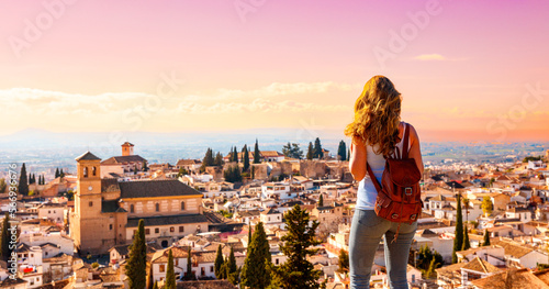 Woman traveler in Granada city panoramic view in Spain photo