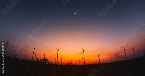 panoramic of a wind turbine farm at sunset.sustainable energy source for smart cities.