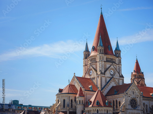 Summer Travel to capital of Austria Vienna. St. Francis of Assisi church or Church Franziska Assizskogo and Danube river embankment in summer photo