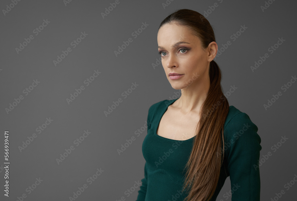 Beautiful young woman portrait isolated on gray background Beautiful young woman portrait isolated on gray background