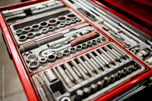 Wrench tool set close up with red colouring and rubber handle