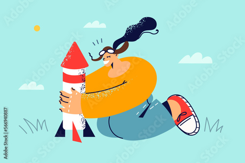 Happy child play with rocket in park 