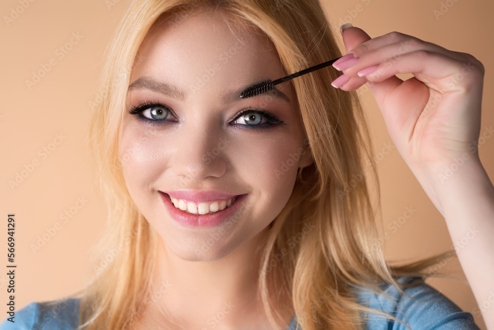 Beautiful woman with perfect shape eyebrows. Womans brows close up. Beautiful girl with eyebrow brush. Eyebrow correction. Long eyelashes and thick eyebrows. Beautiful woman with perfect shape eyebrows. Womans brows close up. Beautiful girl with eyebrow brush. Eyebrow correction. Long eyelashes and thick eyebrows.