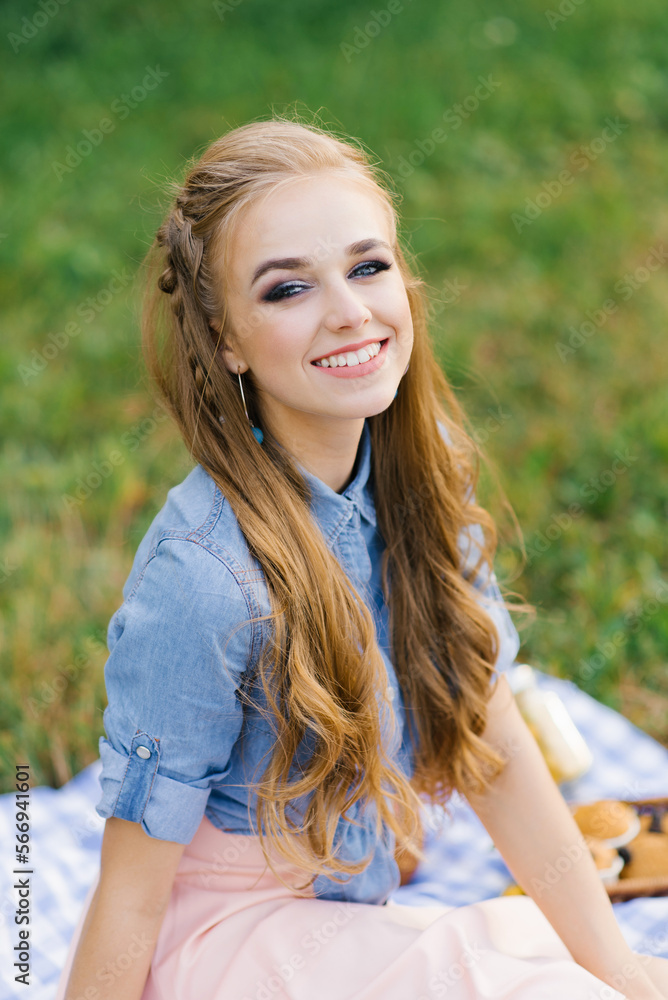 Portrait of a beautiful sweet young woman with long brown hair and a radiant dazzling smile