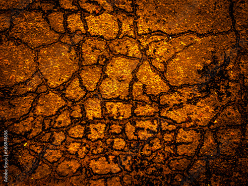 Old cracked asphalt, large natural gold vector grunge background. Unique yellow wallpaper. For screen, desktop, site design, overlay, stencil, background, stylization, design and polygraph design