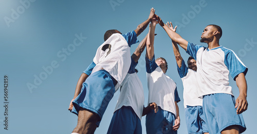 Soccer, team high five and men celebrate winning at sports competition or game with teamwork on field. Football champion group with motivation hands for a goal, performance and fitness achievement photo