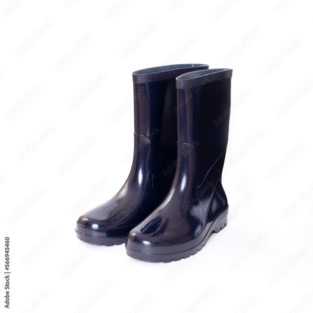 Blue rubber boots with black soles isolated on a white background. Work shoes. Waterproof shoes. Work clothes. Blue rubber boots with black soles isolated on a white background. Work shoes. Waterproof shoes. Work clothes.