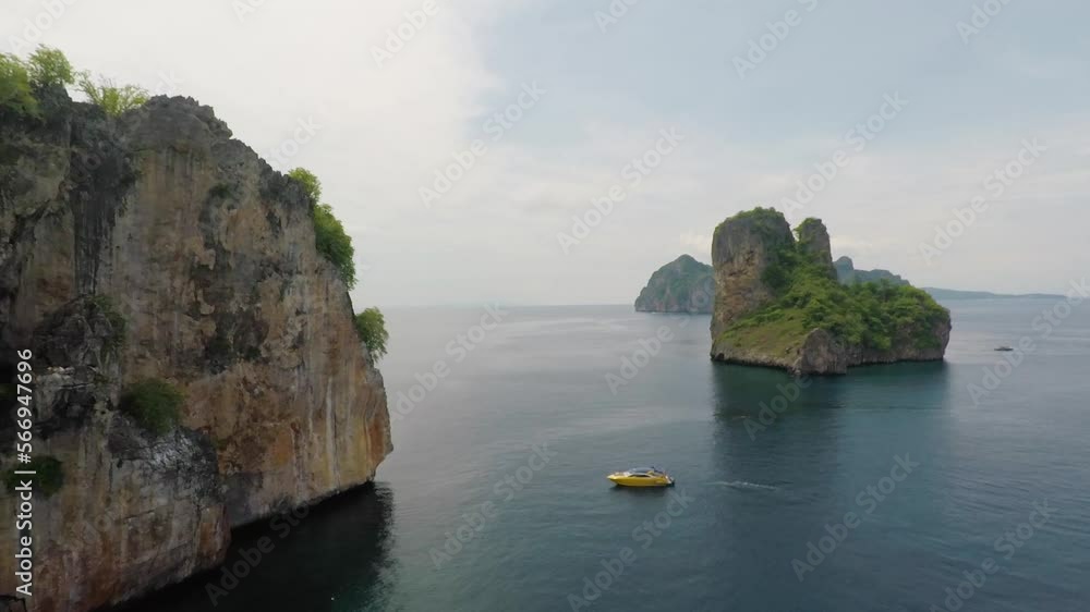 Aerial shot of an island landscape surrounded by the sea and the beautiful sea in Thailand. Aerial shot of an island landscape surrounded by the sea and the beautiful sea in Thailand.