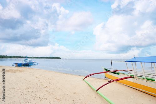 Beautiful landscape with tropical white sand beach with fishing boats. Siargao Island, Philippines. © luengo_ua