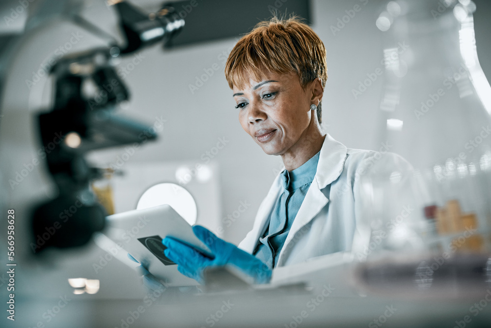 © Clayton D/peopleimages.com - Healthcare, science and black woman with tablet for research, medical report and experiment results. Medicine, laboratory and scientist with digital tech for data analysis, lab study and biotech test