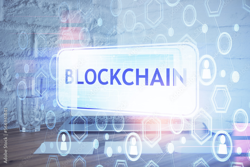 Multi exposure of blockchain and crypto economy theme hologram and table with computer background. Concept of bitcoin cryptocurrency. Multi exposure of blockchain and crypto economy theme hologram and table with computer background. Concept of bitcoin cryptocurrency.