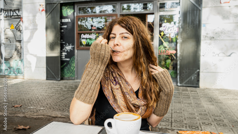 custom made wallpaper toronto digitalGirl with curly hair and gloves having coffee with a spoon in outdoor environment