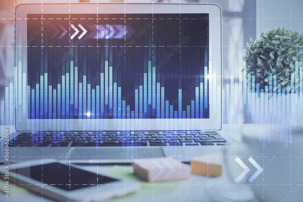 Financial market graph hologram and personal computer on background. Double exposure. Concept of forex. Financial market graph hologram and personal computer on background. Double exposure. Concept of forex.