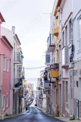 An empty old street leading to the ocean, in the historic center of the Nazare