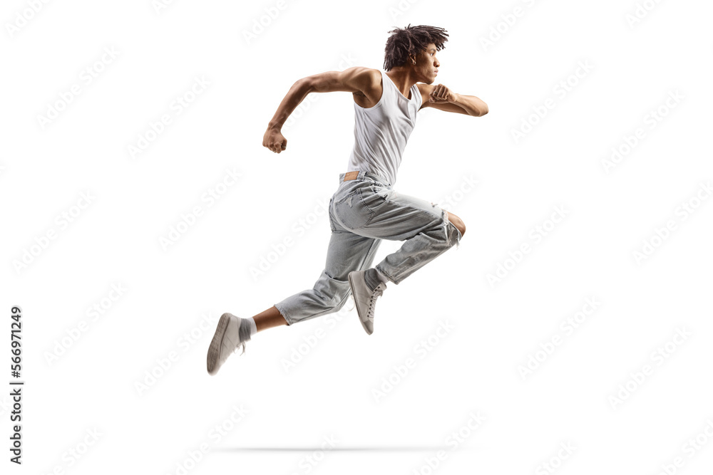 Full length profile shot of an african american male dancer jumping