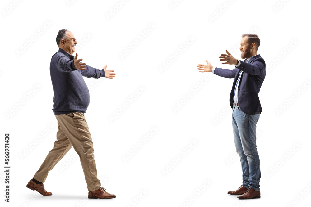 Full length profile shot of two men meeting and greeting