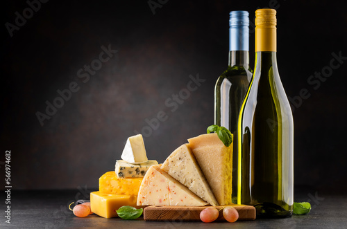 Various cheese on board and white wine