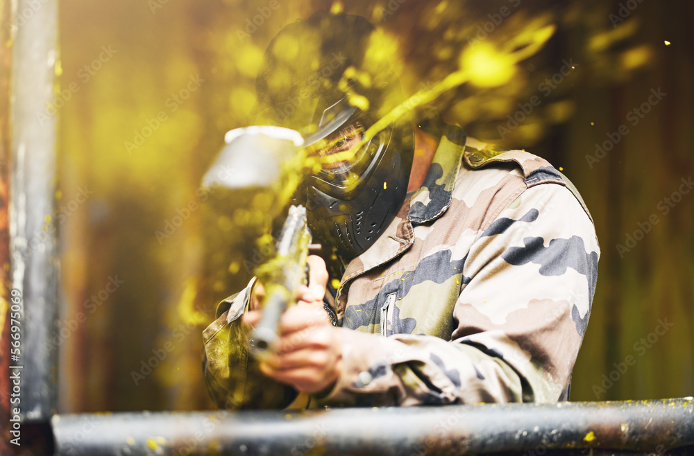 Paintball, soldier and camouflage with a sports man playing a military game for fun or training outdoor. War, gun and target with a male athlete shooting a weapon outside during an army exercise Paintball, soldier and camouflage with a sports man playing a military game for fun or training outdoor. War, gun and target with a male athlete shooting a weapon outside during an army exercise