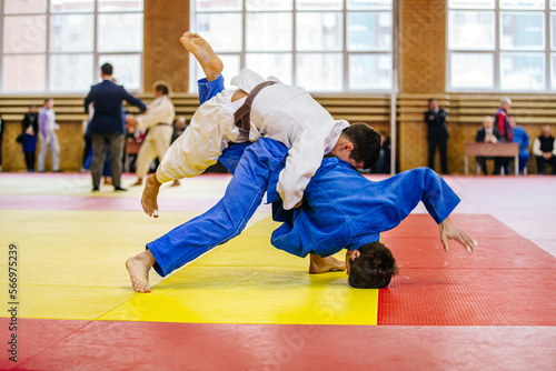 Canvas Print male athletes judoka in judo fight