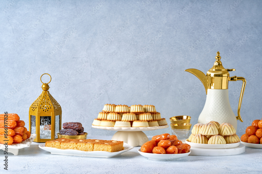 Assorted semolina maamoul or mamoul cookies , awameh or lokma with dallah and ramadan decor. Traditional arabic Eid al Adha, Eid al Fitr , Ramadan sweets - obrazy, fototapety, plakaty 