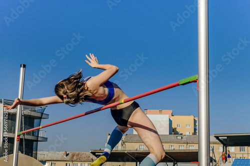 female athlete high jump at athletics competition