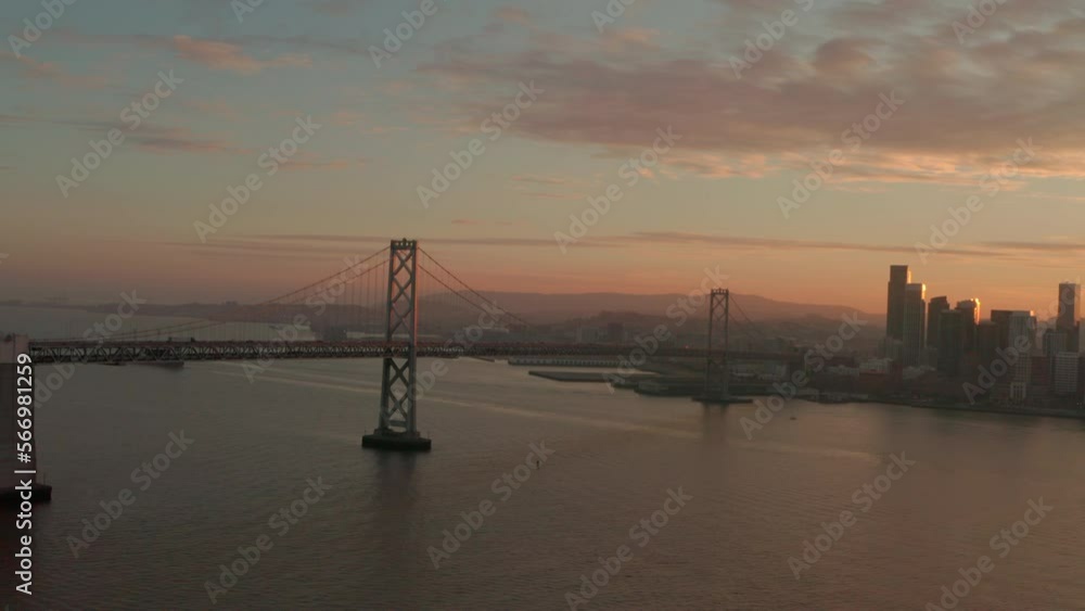 Rising circling aerial shot of Bay Bridge at golden hour Rising circling aerial shot of Bay Bridge at golden hour