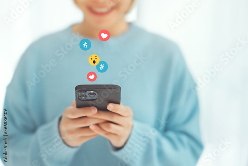 Hands of woman chat typing on smart phone relax watch live video and post button love, heart, chat, emoji icon, Social media, social network concept