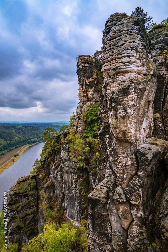 Panoramic birdview over monumental Bastei sandstone pillars near Kurort Rathen village in the national park Saxon Switzerland by Dresden and Elbe river, Saxony, Germany