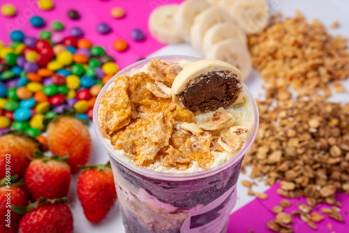 фотографія close up of acai or açaí cup with topping corn flake and sugarplum in colorful b