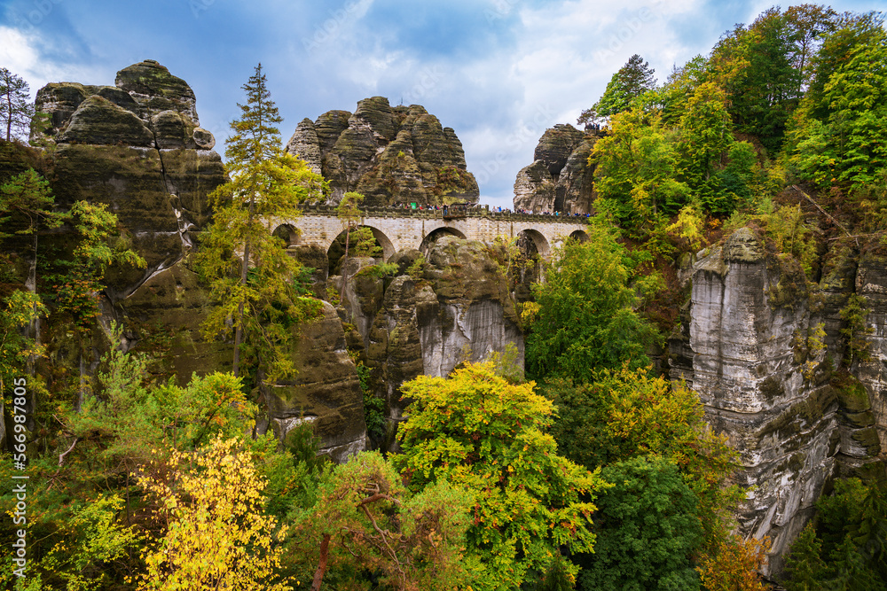 Panoramic birdview over monumental Bastei sandstone pillars near Kurort Rathen village in the national park Saxon Switzerland by Dresden and Elbe river, Saxony, Germany Panoramic birdview over monumental Bastei sandstone pillars near Kurort Rathen village in the national park Saxon Switzerland by Dresden and Elbe river, Saxony, Germany